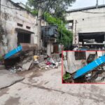 LB Nagar ward office street with fallen BSNL box and dumped garbage near metro station